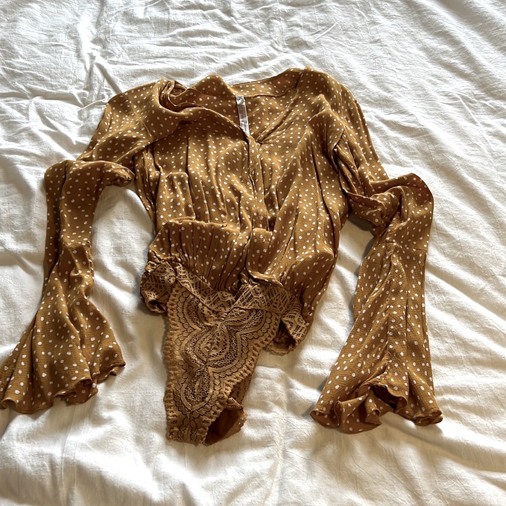 Free people polka dot bodysuit. Note: the top button came off and is broke!